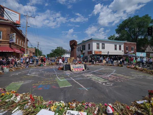 In Minneapolis, visitors link three fatal encounters into a growing circuit of public mourning sites